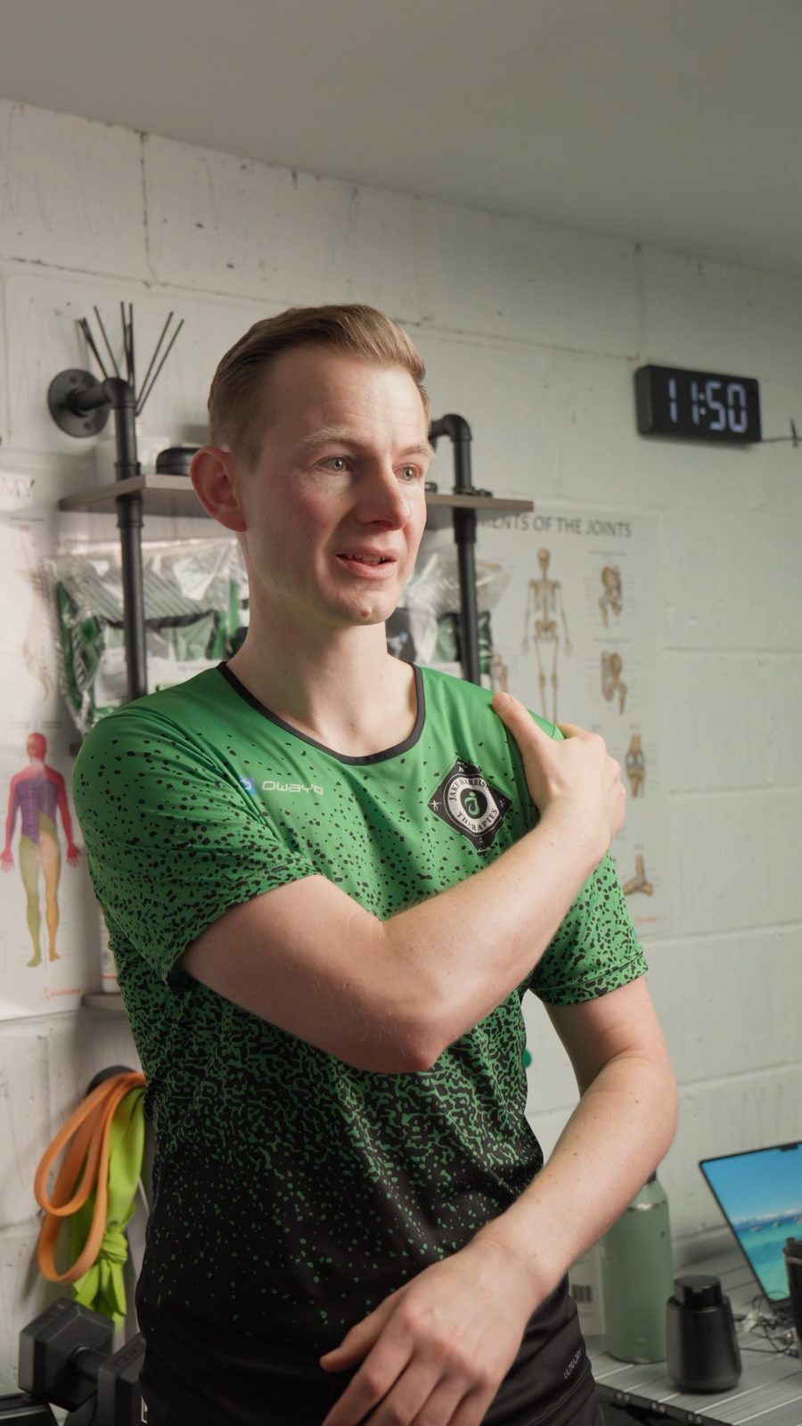 Jake explaining a shoulder assessment finding at his Sheffield Movement Therapy clinic